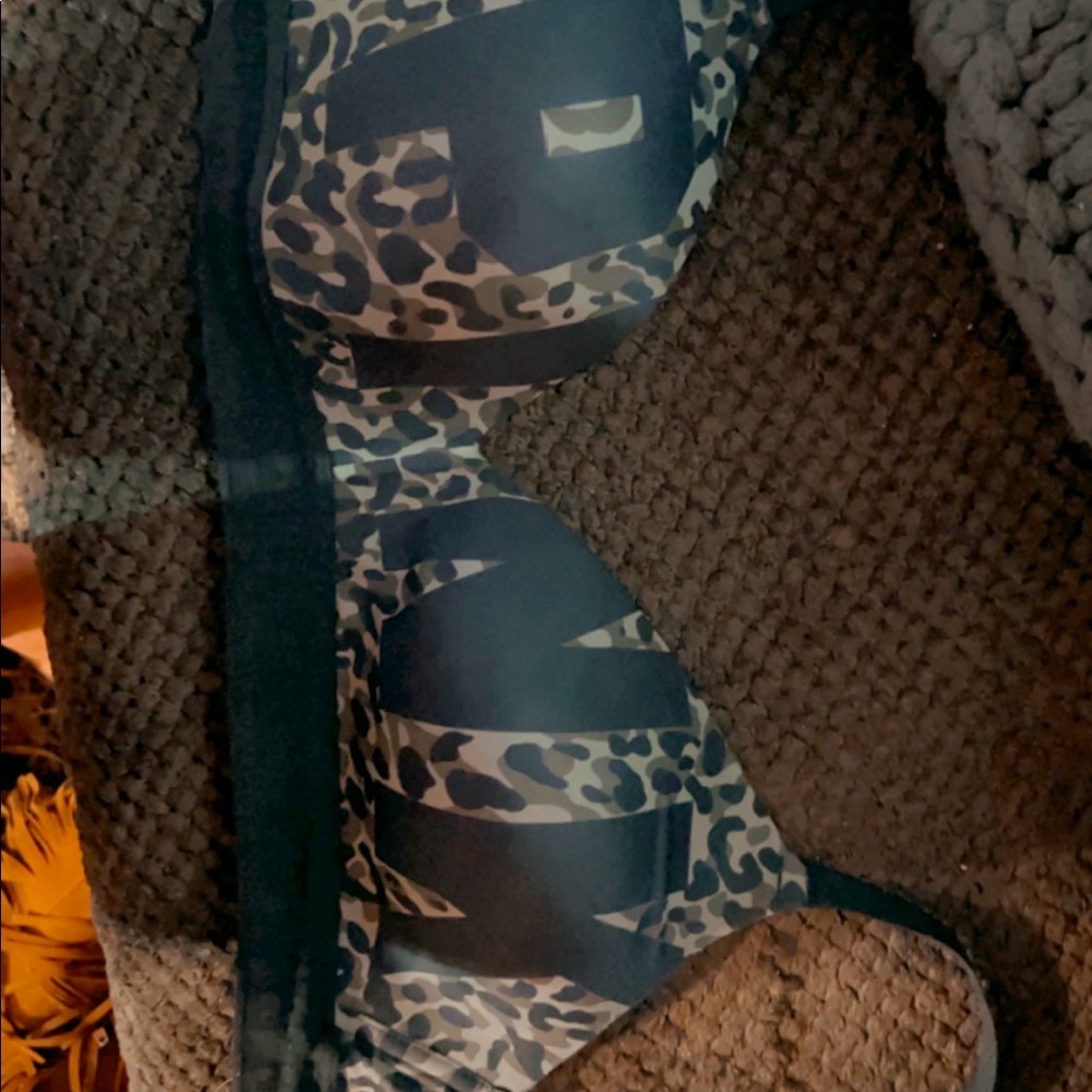 Victorias Secret 32 DD bra leopard print with black letters. Never worn.